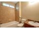 Bathroom featuring tile floors, tub, shower head, toilet, and sink at 4050 Old Fairburn Rd, Atlanta, GA 30349