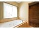 Bathroom with tile floors, tub, and separate shower at 4050 Old Fairburn Rd, Atlanta, GA 30349