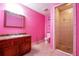 Full bathroom with dark wood vanity, bright walls, and a stand-up shower with tile surround at 4050 Old Fairburn Rd, Atlanta, GA 30349