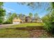 Charming two-story home featuring a two-car garage, brick and vinyl siding, and a lush green lawn at 4050 Old Fairburn Rd, Atlanta, GA 30349