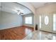 Open-concept entrance with hardwood floors and decorative front door, creating a warm ambiance at 4050 Old Fairburn Rd, Atlanta, GA 30349