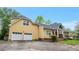 Lovely house with a two-car garage, complemented by a well-kept lawn and inviting front porch at 4050 Old Fairburn Rd, Atlanta, GA 30349
