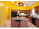 Bright eat-in kitchen with tile floors, wooden cabinets and an island at 4050 Old Fairburn Rd, Atlanta, GA 30349