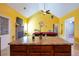 Spacious living room with brick fireplace, pool table, and access to another room at 4050 Old Fairburn Rd, Atlanta, GA 30349