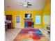 Bright and open living room featuring tile floors, a brick fireplace, and access to the kitchen at 4050 Old Fairburn Rd, Atlanta, GA 30349