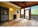 Charming outdoor space featuring wooden deck, ceiling fan, and exterior door entrance at 4050 Old Fairburn Rd, Atlanta, GA 30349