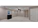Finished basement with recessed lights and neutral paint at 4490 Highway 138 Sw, Stockbridge, GA 30281