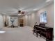 Large basement rec space with gym area, piano and recessed lighting at 4490 Highway 138 Sw, Stockbridge, GA 30281