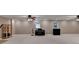 Large finished basement with neutral walls, carpet, and ceilings, with musical instruments and other furnishings at 4490 Highway 138 Sw, Stockbridge, GA 30281