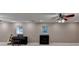 Spacious basement rec room featuring a piano and guitar at 4490 Highway 138 Sw, Stockbridge, GA 30281