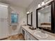 Bathroom offers white cabinets, spacious countertop, and large framed mirrors at 4490 Highway 138 Sw, Stockbridge, GA 30281