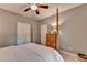 Comfortable bedroom with four-poster bed, fan, and plenty of storage at 4490 Highway 138 Sw, Stockbridge, GA 30281