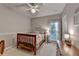Serene bedroom with natural light, side table, and calming paint colors at 4490 Highway 138 Sw, Stockbridge, GA 30281