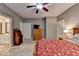 Bedroom offers neutral walls, ceiling fan, carpet floors, and connects to the bathroom at 4490 Highway 138 Sw, Stockbridge, GA 30281