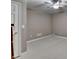 Bedroom with a ceiling fan for comfort, neutral walls, and a white door at 4490 Highway 138 Sw, Stockbridge, GA 30281