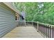 New deck extends from the home with a view to a private, wooded backyard at 4490 Highway 138 Sw, Stockbridge, GA 30281