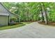 Long driveway leading to a charming home surrounded by mature trees at 4490 Highway 138 Sw, Stockbridge, GA 30281