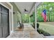 Relaxing front porch with swing and rocking chair, perfect for enjoying the outdoors at 4490 Highway 138 Sw, Stockbridge, GA 30281