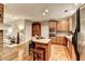 Traditional kitchen features wood cabinets, an island cooktop, stainless steel appliances and hardwood floors at 4490 Highway 138 Sw, Stockbridge, GA 30281