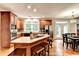Spacious kitchen featuring wooden cabinets, stainless steel appliances, and an island with seating at 4490 Highway 138 Sw, Stockbridge, GA 30281