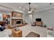Bright living room featuring an inviting fireplace, hardwood floors, and ample seating at 4490 Highway 138 Sw, Stockbridge, GA 30281
