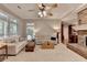 Bright living room with large windows, hardwood floors, and a cozy fireplace at 4490 Highway 138 Sw, Stockbridge, GA 30281