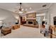 Cozy living room with a brick fireplace, plush seating, and hardwood floors at 4490 Highway 138 Sw, Stockbridge, GA 30281