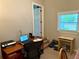 Home office space with a window for natural light and neutral carpet at 4490 Highway 138 Sw, Stockbridge, GA 30281