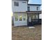 Exterior view of a newly constructed home with a covered back porch and stairs leading to the yard at 503 Glendale Rd, Scottdale, GA 30079