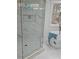 Elegant bathroom featuring a glass shower, soaking tub, and marble accents at 503 Glendale Rd, Scottdale, GA 30079