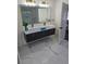 Modern bathroom featuring double sinks, vanity and large mirror with great lighting at 503 Glendale Rd, Scottdale, GA 30079
