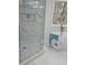 Elegant bathroom featuring a glass shower, soaking tub, and marble accents at 503 Glendale Rd, Scottdale, GA 30079