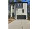 Modern two-story home with black trimmed windows and a black garage door at 503 Glendale Rd, Scottdale, GA 30079