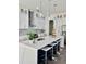 Bright, modern kitchen with a large island, stainless steel appliances, and pendant lighting at 503 Glendale Rd, Scottdale, GA 30079