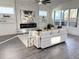 Bright living room with fireplace, modern decor, large windows and hardwood floors at 503 Glendale Rd, Scottdale, GA 30079