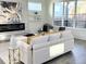 Bright living room with fireplace, modern decor, large windows and hardwood floors at 503 Glendale Rd, Scottdale, GA 30079