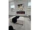 Modern living room featuring a fireplace, stylish decor, and comfortable ottoman creating a relaxing and inviting atmosphere at 503 Glendale Rd, Scottdale, GA 30079