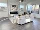 Bright living room with a fireplace, modern decor, and large windows at 503 Glendale Rd, Scottdale, GA 30079