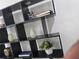 Modern shelving unit with decor items and books at 503 Glendale Rd, Scottdale, GA 30079