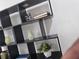 Modern shelving unit with decor items and books at 503 Glendale Rd, Scottdale, GA 30079