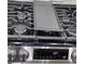 Close-up of a ThinQ gas stove top with black grates and stainless knobs, showcasing modern kitchen appliances at 503 Glendale Rd, Scottdale, GA 30079