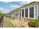 This backyard has a stone patio, and a well manicured lawn with shrubbery at 5695 Overlook Station Dr, Suwanee, GA 30024