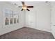 Bright bedroom featuring shuttered windows and neutral carpet, creating a comfortable and inviting space at 5695 Overlook Station Dr, Suwanee, GA 30024