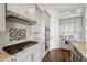 Well-equipped kitchen with granite countertops, stainless steel appliances, and custom cabinetry at 5695 Overlook Station Dr, Suwanee, GA 30024