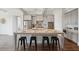 Kitchen island with granite countertop, seating, and stainless steel appliances at 5695 Overlook Station Dr, Suwanee, GA 30024