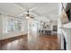 Bright, open living area with hardwood floors, coffered ceilings, and view of gourmet kitchen at 5695 Overlook Station Dr, Suwanee, GA 30024