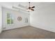 Spacious main bedroom with tray ceiling, awaiting a new owner to make it their own at 5695 Overlook Station Dr, Suwanee, GA 30024