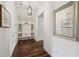 Convenient mudroom with built-in shelving, bench seating, and hardwood floors at 5695 Overlook Station Dr, Suwanee, GA 30024