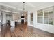 Open-concept kitchen and dining area with hardwood floors and modern appliances at 5695 Overlook Station Dr, Suwanee, GA 30024