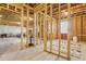 Unfinished basement area featuring exposed beams and framing, ready for personalized design and build-out at 1180 Trident Maple, Lawrenceville, GA 30045